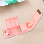 Comparison shot showing the compact size of the Mini Plastic Bag Sealer next to common items.