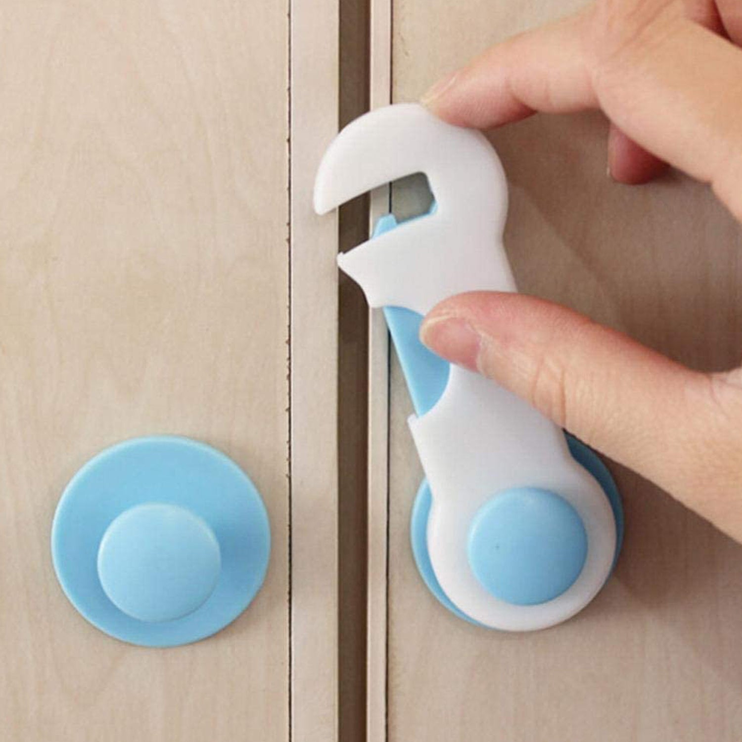 Child safety lock securing a refrigerator door, protecting food and contents.