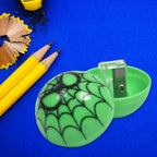 Colourful round pencil sharpener featuring cute cartoon patterns for children.