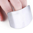 Ergonomic stainless steel finger guard providing essential kitchen safety during meal prep.