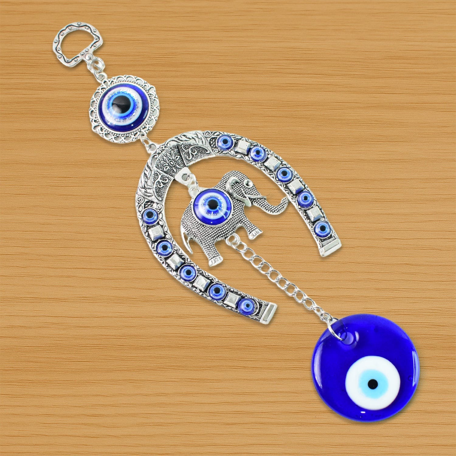 Handcrafted evil eye wall hanging featuring beads and tinkling chime