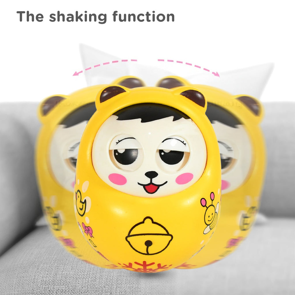 Close-up of the adorable animal face on the musical roly poly toy