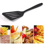 Non-stick silicone kitchen turner, ideal for delicate foods.