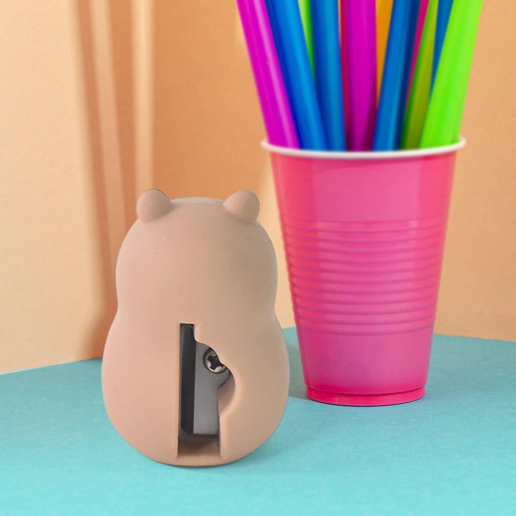 Cartoon pencil sharpener with built-in eraser in playful design