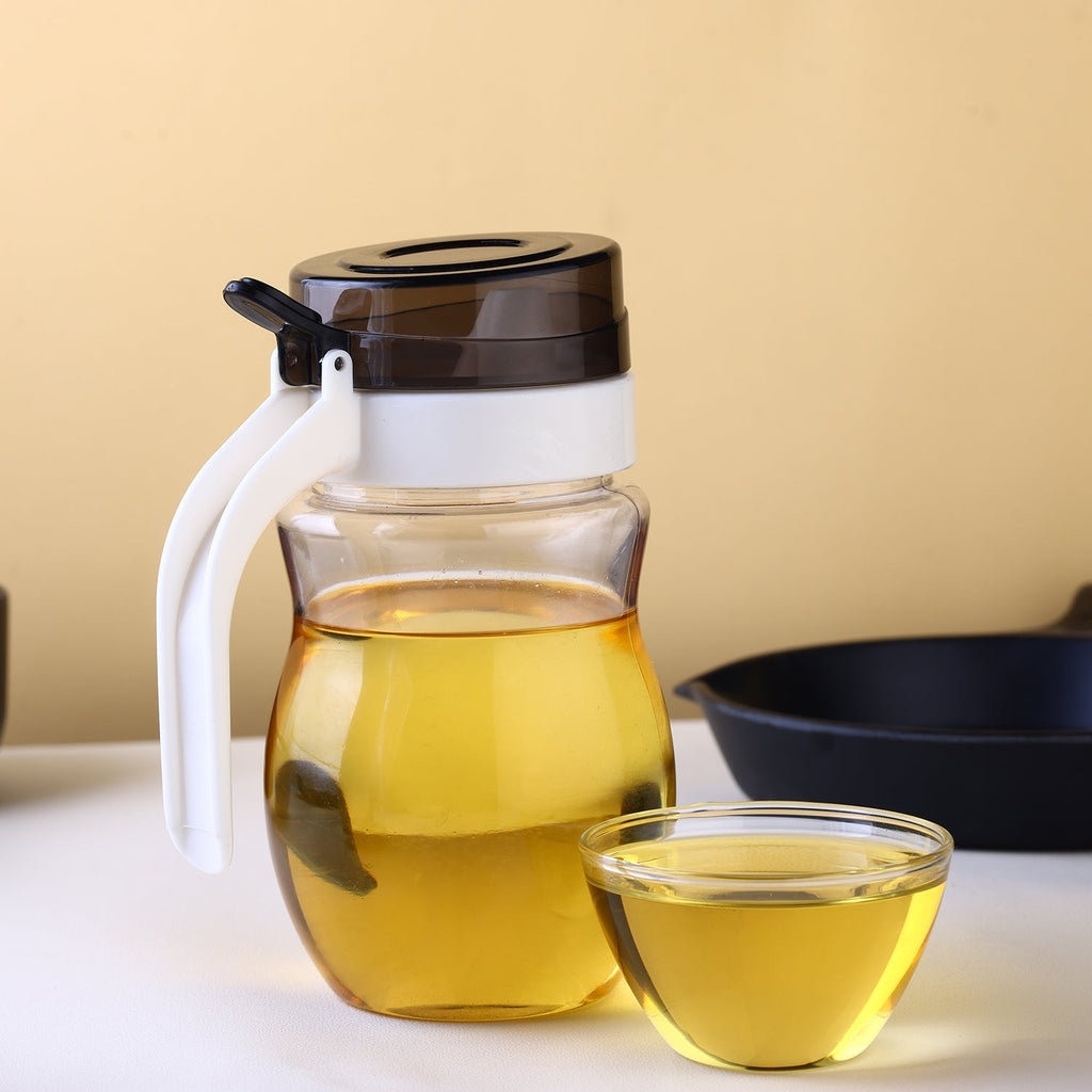 Sleekly designed plastic kitchen oil dispenser.