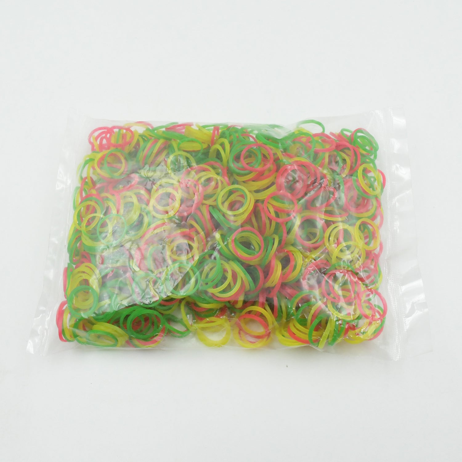 Close-up of 0.75 inch multicolor elastic rubber bands for versatile office and school use.