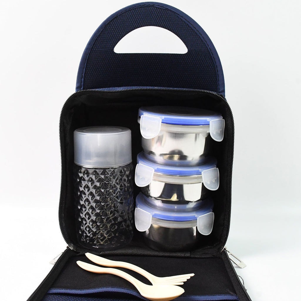 Person carrying a stylish stainless steel lunch box set to the office.