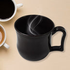 Close-up of the smooth, matte finish of a durable black plastic coffee mug.