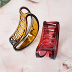 Hair accessory plastic clamp with matte surface ideal for face washing and styling.