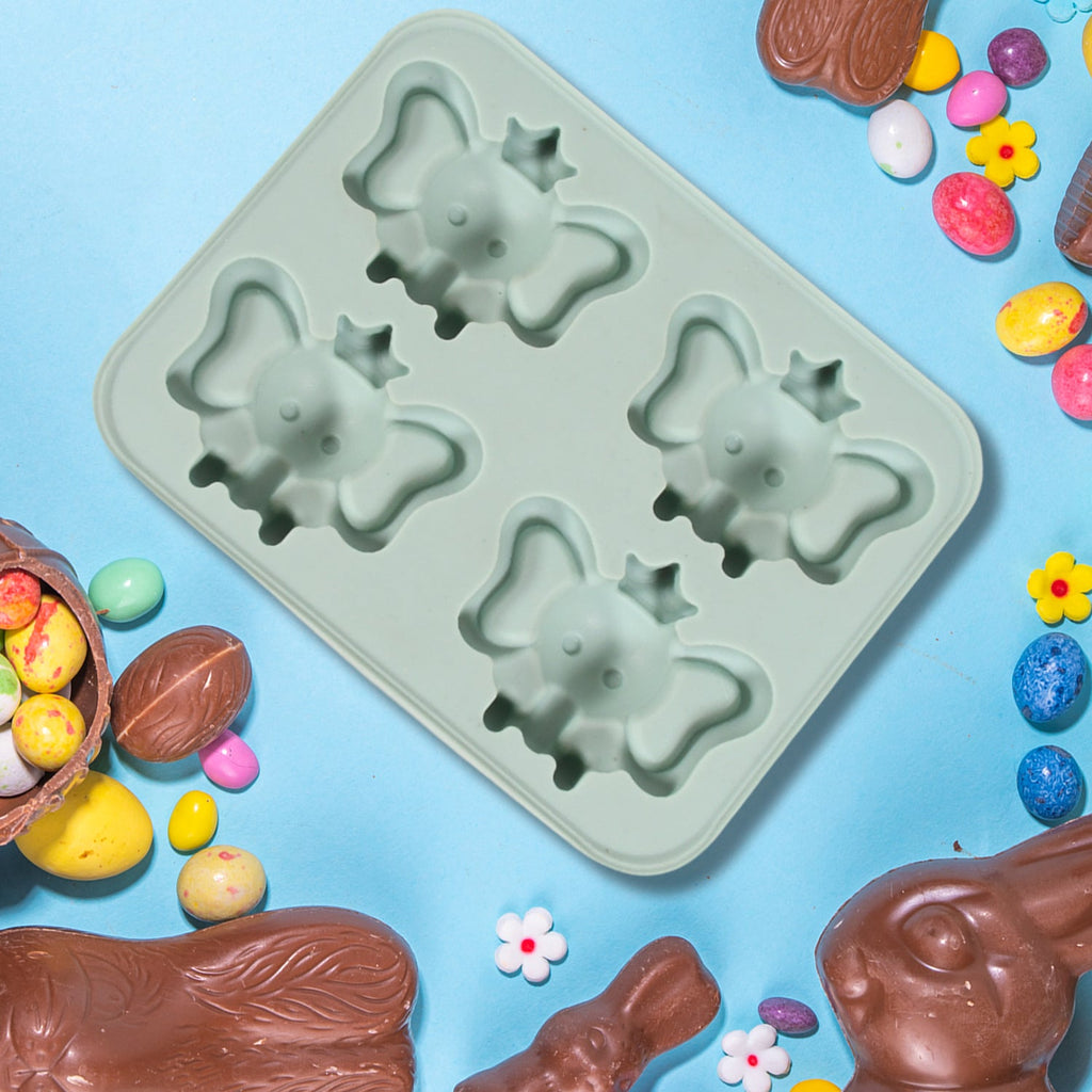 The flexible cartoon ice cube tray filled with water, ready for freezing.