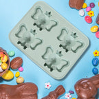 The flexible cartoon ice cube tray filled with water, ready for freezing.