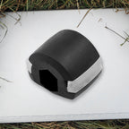 Side profile of the black Jaw Exerciser, showing its compact size.