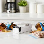 Mini heat sealer sealing a snack plastic bag securely