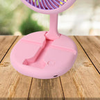 A close-up of the USB charging port on the portable fan.