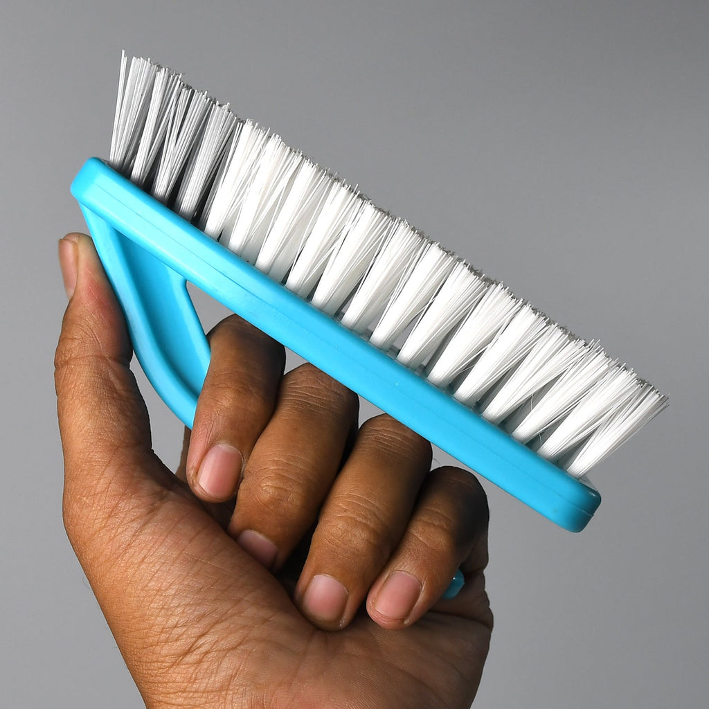 Ergonomic floor scrub brush with strong plastic handle for effective cleaning.