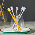 Soft plastic toothbrush set with vibrant colors and a portable round box, perfect for family oral hygiene.