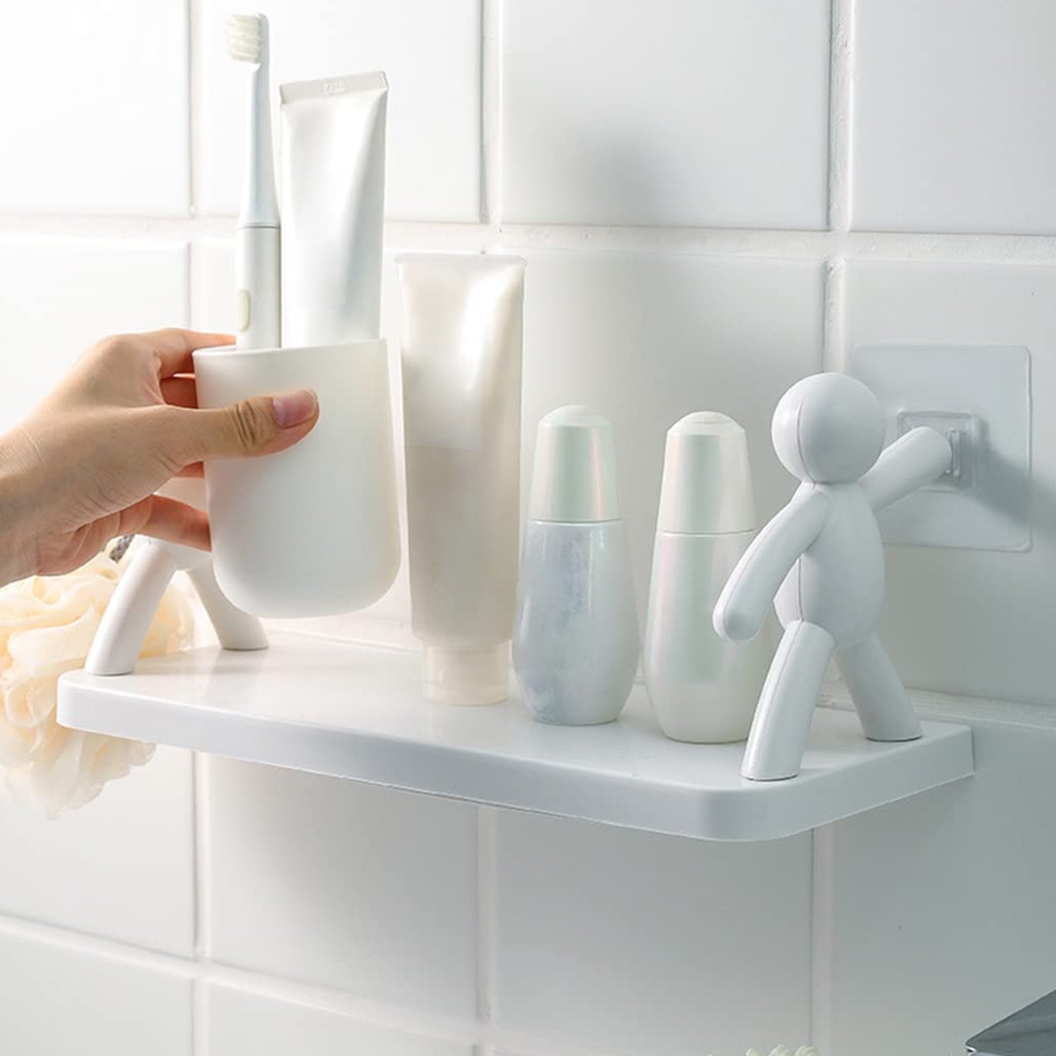 Stylish wall shelf with human figurine design, adding a unique touch to any room.