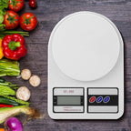 Compact digital kitchen scale with a 10 kg capacity on a white background.