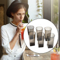 A set of six black square plastic tumblers for water, juice, beer, or wine.