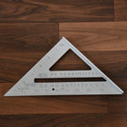 The lightweight BoltForce triangle ruler displayed next to other essential woodworking tools.
