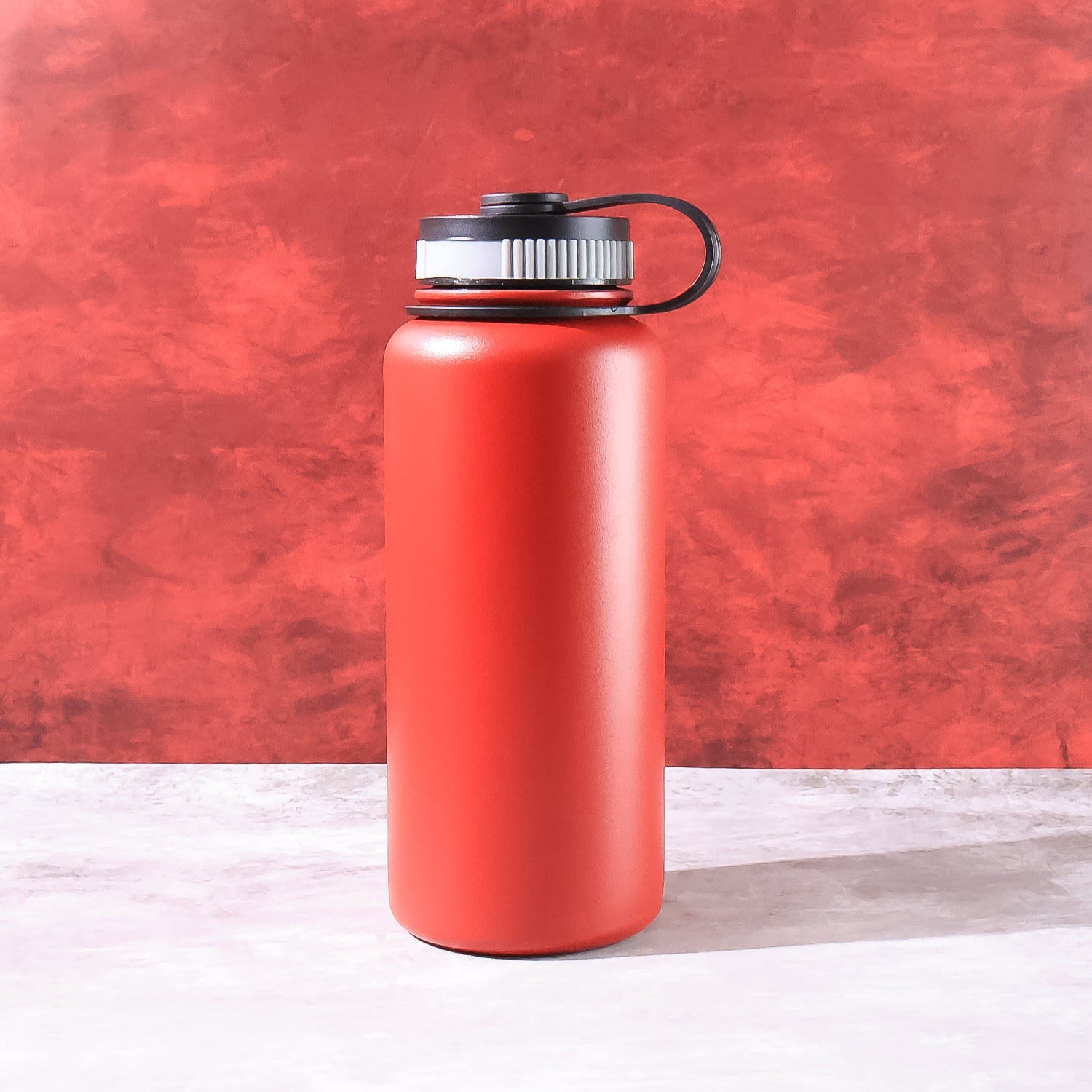 Stainless steel water bottle with leak-proof cap and sweat-proof exterior