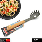Close-up of the plastic pasta fork's tines, showing its non-stick safe design.
