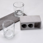 Elegant wine glass holder set with two glasses on a marble base, ideal for home decor.
