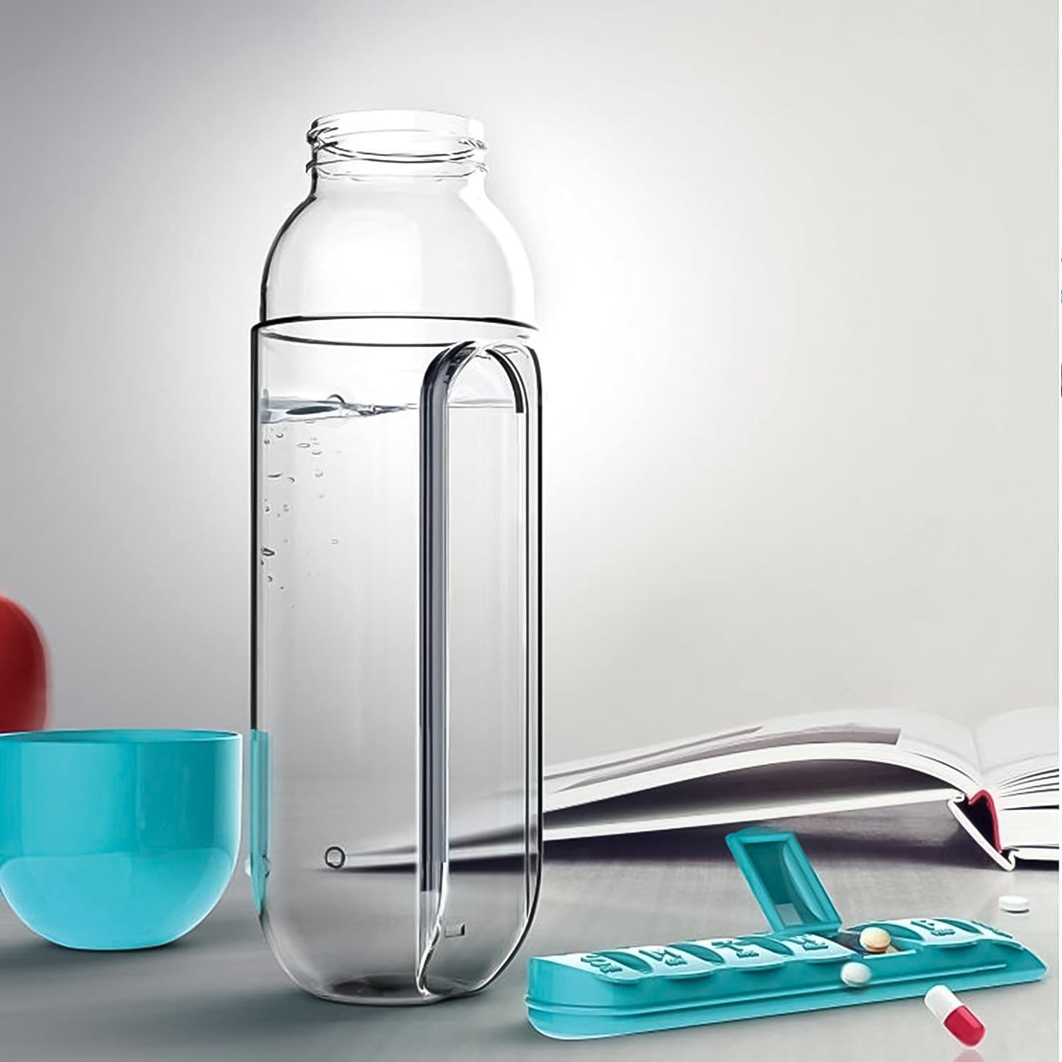 Multi-use water bottle with integrated pill organizer for hydration and medication.