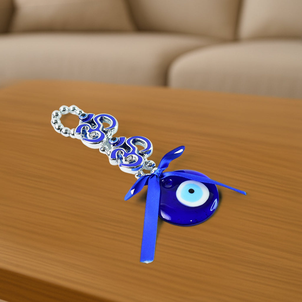 Close-up image of evil eye beads and satin ribbon on double OM hanging