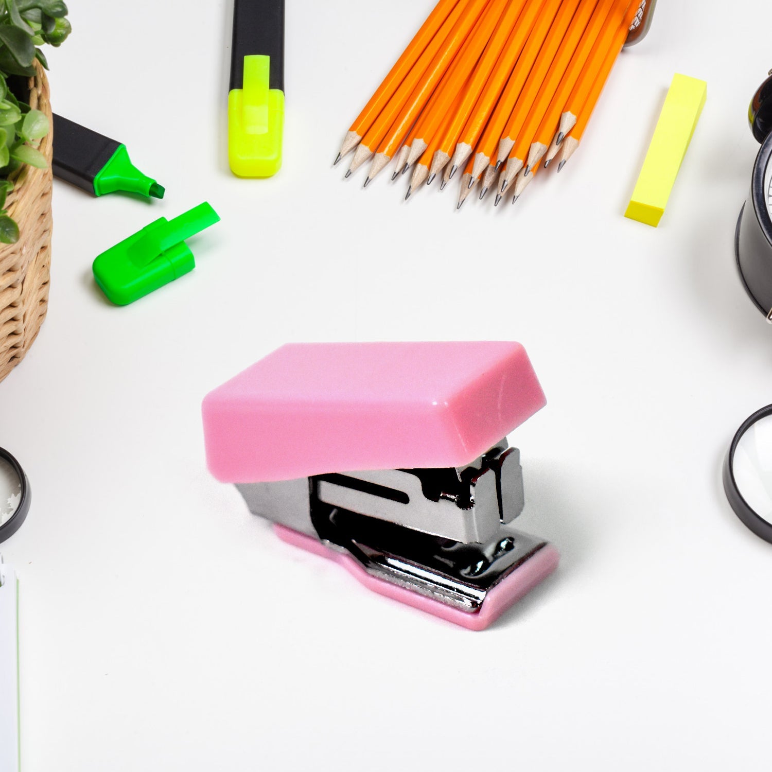 Close-up of the compact desk essentials from the mini stationery kit, showing the stapler and scissors.