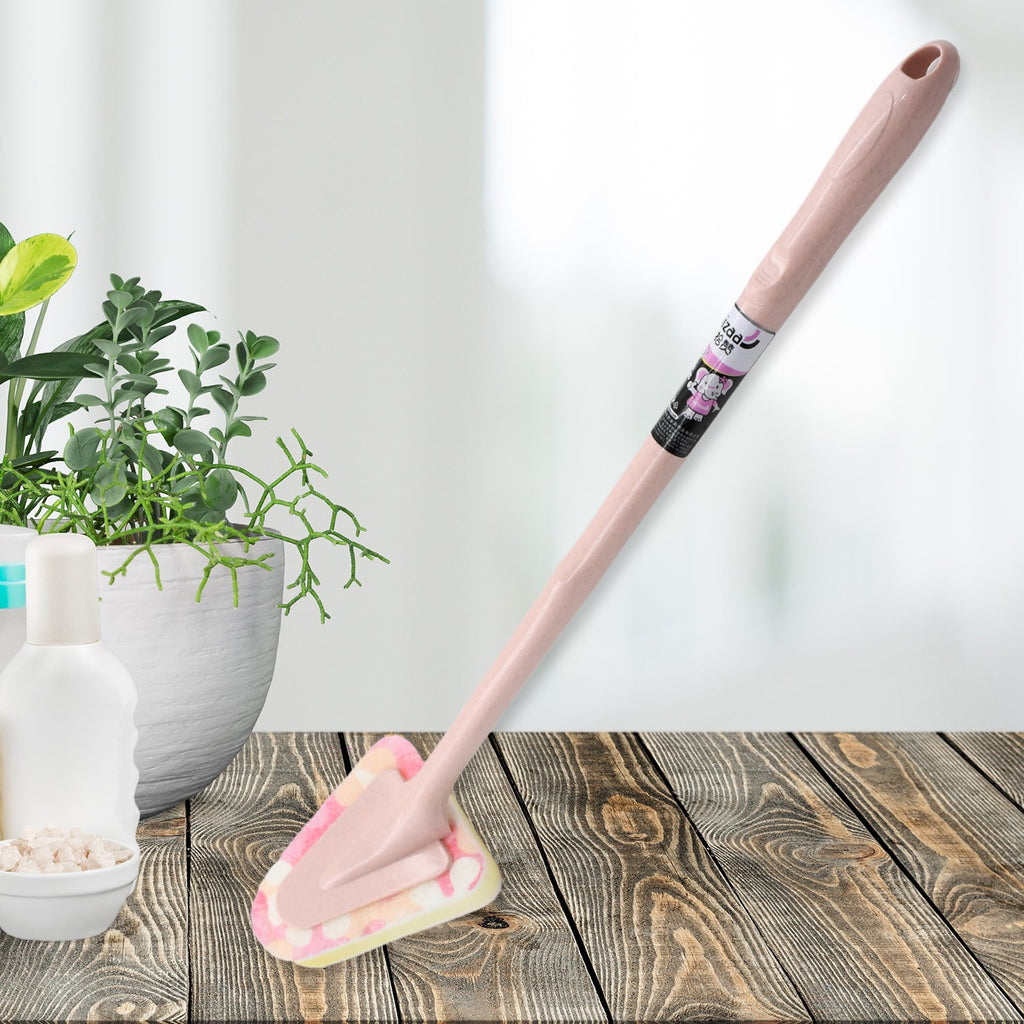 Triangular cleaning brush with long handle, ready for kitchen use.