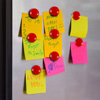 Close up of red magnetoPress circular magnetic buttons on board