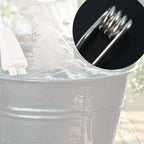 Bucket water heater rod heating water in a basin for daily use