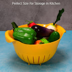 A plastic rice washing bowl in blue, perfect for draining fruits and vegetables.