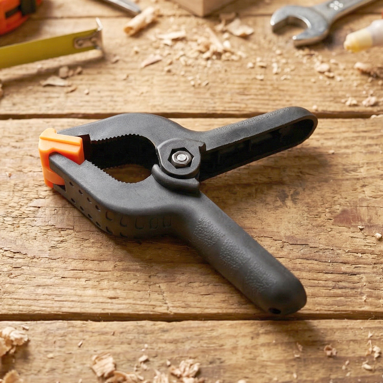 Spring clamp held in hand demonstrating one hand operation ease