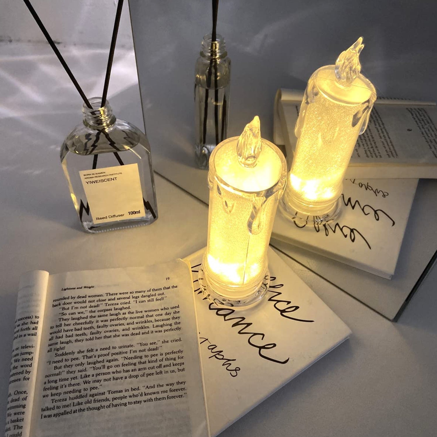 Close-up of a single flameless LED Tea Light Candle illuminating a surface.