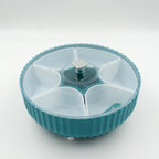 Top-down view of the revolving container filled with various dry fruits.