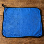 Lifestyle image of a clean glass surface wiped with microfiber cloth