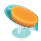 Self draining soap dish holder securely mounted on a tiled wall.