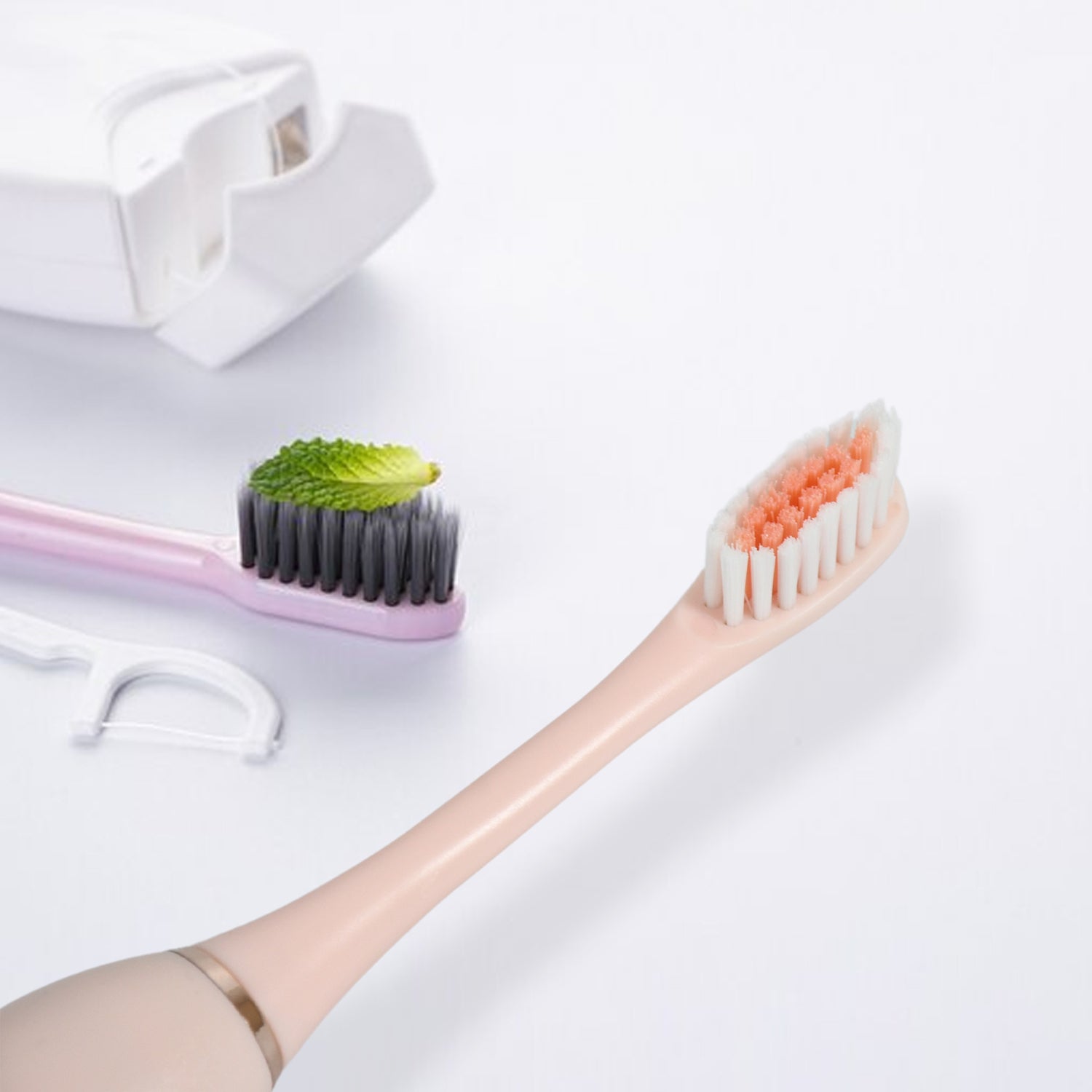 BrushedUp Electric Toothbrush held by a hand, demonstrating its lightweight and comfortable grip.