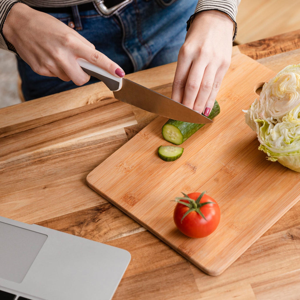 Large bamboo cutting board for kitchen prep, showcasing its smooth surface.