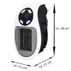 Energy-saving desktop heater plugged directly into a wall socket with its 360-degree rotating plug.