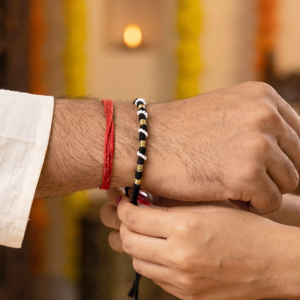 Pearl and golden bead work on traditional festival rakhi