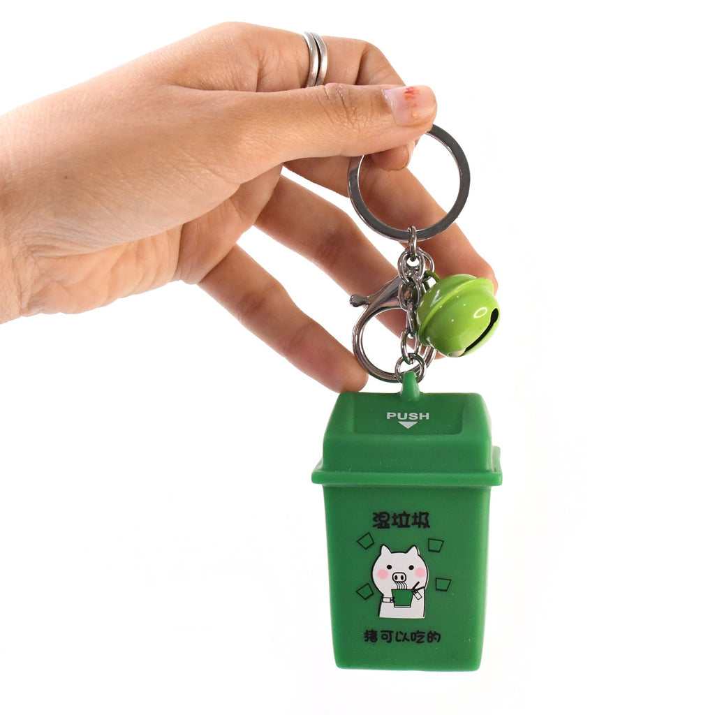 Recycle bin charm detail on Trash Can Keychain promoting recycling awareness