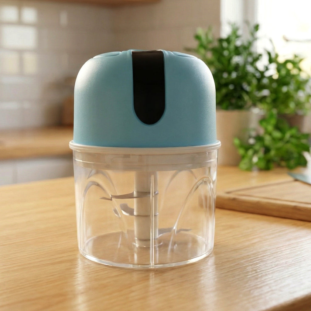 Another angled side view of the portable mini electric garlic chopper.