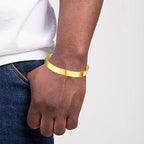 Solstice curve open Kada bracelet showcasing gold finish and smooth design