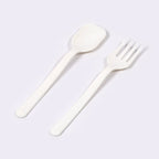 Two pieces of Quickslice heavy-duty plastic cutlery, a fork and a spoon, ready for use.