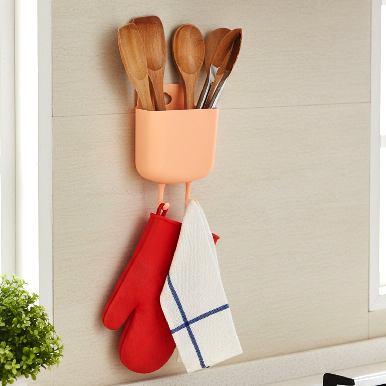Plastic wall mounted organizer with compartments for phone and remotes
