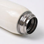 Vacuum-insulated stainless steel water bottle closed with leak-proof cap