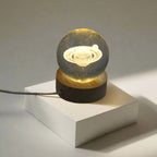Astronaut Crystal Ball Night Light on a rustic wooden base.